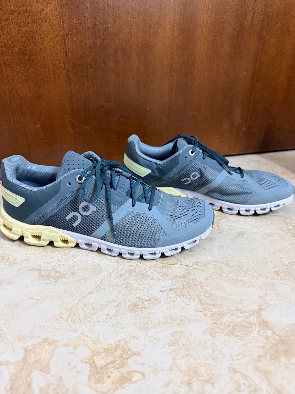 On Cloud Running Shoes in Slate Blue with Pale Yellow Accents